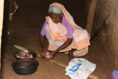 poor woman cooking meat