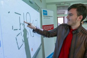 Male student testing out the new smart board